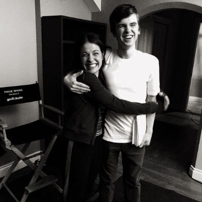 Photo of Paige Spara along hugging her boyfriend. 